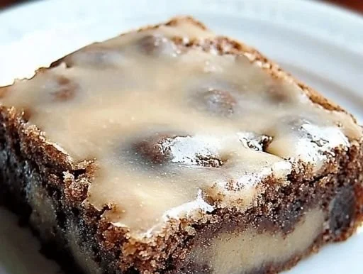 Delicious banana bread brownies topped with chocolate and nuts.
