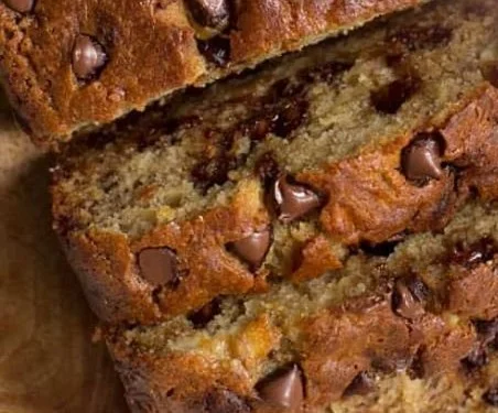 Freshly baked chocolate chip banana bread loaf with chocolate chips on top