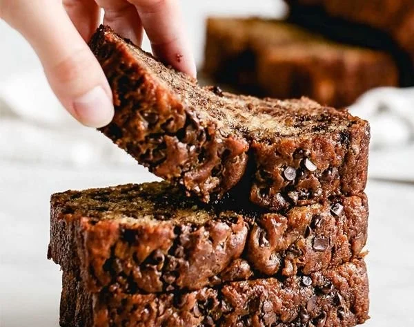 Delicious Chocolate Chip Banana Bread sliced on a wooden board