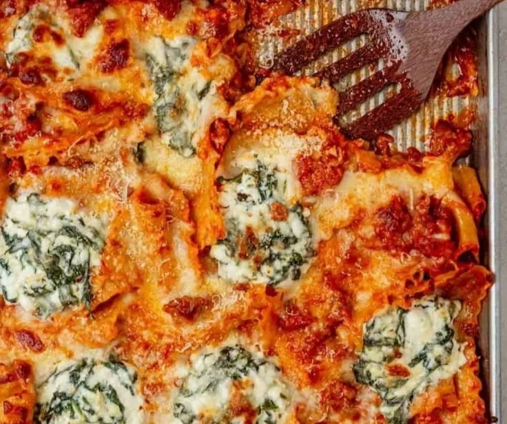 Delicious sheet pan lasagna freshly baked and served on a wooden table