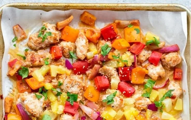 Sheet pan meal featuring Hawaiian Chicken with vegetables, healthy and flavorful.
