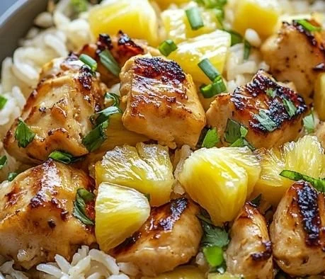 Delicious pineapple chicken served over fluffy rice for a perfect meal.