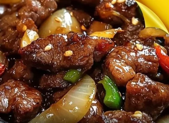 Delicious Chinese pepper steak with onions served on a plate