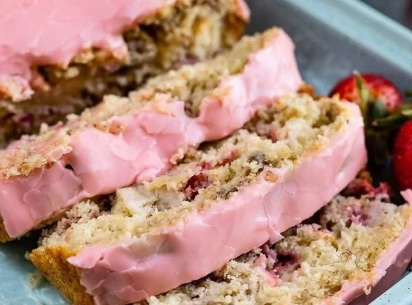 Freshly baked strawberry banana bread with slices ready to serve